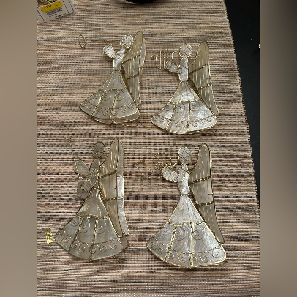 Four capiz shell  angels with four separate instruments, minor imperfections